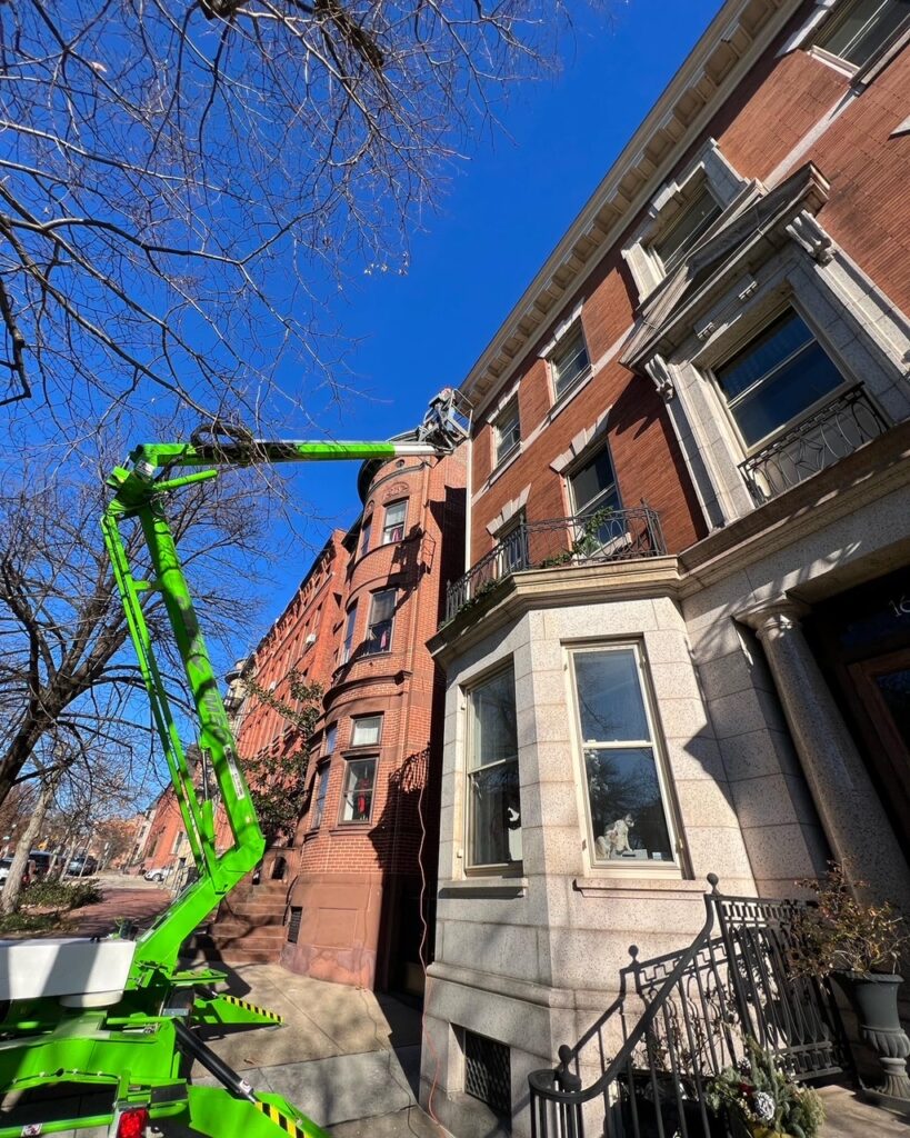 A corncie paint job and repair in Bolton Hill, Baltimore, Maryland.